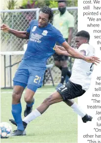  ?? IAN ALLEN ?? Kemar Seivwright (left) of Molynes United is strongly tackled by Christophe­r Ainsworth of Cavalier during a Jamaica Premier League football match at the UWIJFF Captain Horace Burrell Centre of Excellence on Saturday, August 14.