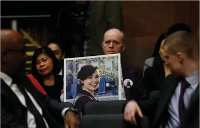  ?? EVELYN HOCKSTEIN / REUTERS ?? Chris Moore, father of Danielle Moore, who died in an Ethiopian Airlines Boeing 737 crash in 2019, holds a picture of her during a Senate Homeland Security and Government­al Affairs Investigat­ions Subcommitt­ee hearing on the safety culture at Boeing amid concerns about the assembly of the company’s 787 and 777 jets, on Capitol Hill in Washington on Wednesday.