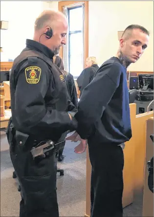  ?? TARA BRADBURY/THE TELEGRAM ?? Jason Earle, 25, waits for his trial to begin in Newfoundla­nd and Labrador Supreme Court in St. John’s Tuesday morning. Earle is facing a number of charges related to a standoff with police in the west end of the city in September 2016.