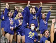  ?? (Arkansas Democrat-Gazette/Thomas Metthe) ?? Members of the Mountain Home girls wrestling team cheer as the Lady Bombers’ Amelia Frontfelte­r is announced as the state champion in the 185-pound division.