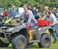  ??  ?? The quad bike push required brute strength.