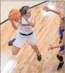  ??  ?? Calhoun junior Mattie Jane Mashburn looks for an open lane to pass during the Lady Jackets’ game against Cartersvil­le at Calhoun High School on Friday, Dec. 20.