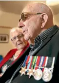  ?? KAVINDA HERATH/STUFF ?? WWII veteran Jim Sherborne wears his medals.