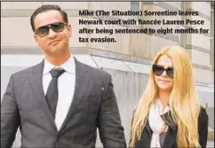  ?? SPLASHNEWS.COM ?? Mike (The Situation) Sorrentino leaves Newark court with fiancée Lauren Pesce after being sentenced to eight months for tax evasion.