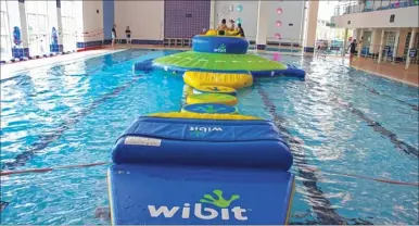  ??  ?? The new Wibit inflatable stretches almost the length of the main pool at the Stour Centre