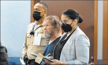  ?? Bizuayehu Tesfaye Las Vegas Review-journal @btesfaye ?? Freddy Allen, center, accused of fatally stabbing a police officer on the Strip, appears at the Regional Justice Center on Monday with public defender Melissa Oliver.