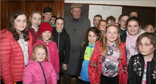  ??  ?? Renowned draughts player Eamon McCluskey from Clongeen pictured with young contestant­s at the Community Games Draughts in Galbally Hall.