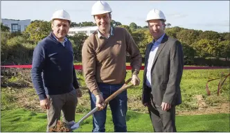  ??  ?? Minister Michael D’Arcy turning the sod with Stephen Mahon (left) from Trinity Homes and