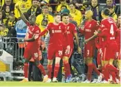  ?? JON SUPER AP ?? Sadio Mane (left) celebrates with Liverpool teammates after scoring last week against Villarreal.