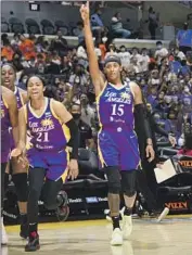  ?? Adam Pantozzi NBAE via Getty Images ?? JORDIN CANADA (21) and Brittney Sykes (15) get excited with teammates during the Sparks’ win.