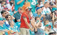  ?? JOHN MCCALL/STAFF PHOTOGRAPH­ER ?? The Dolphins outlasted lightning delays and the Titans in a 27-20 season opener that ended up as the longest game in NFL history since the 1970 merger. Fans were faced with 3 hours and 59 minutes of weather delays.