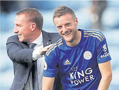  ??  ?? Leicester City manager Brendan Rodgers, left, and striker Jamie Vardy celebrate a win.