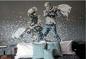  ??  ?? British street artist Banksy’s Walled Off Hotel, which features his works, has helped to boost tourism in Bethlehem.