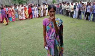  ??  ?? A large number of the voters who turned up were women, dressed in colourful saris and some draped in Assamese shawls.