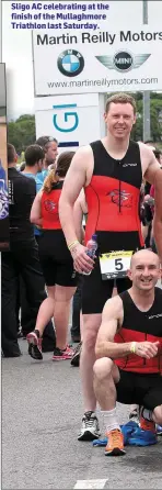  ??  ?? INSET: Michal Czubala presenting lady winner Sasha Gannon Sligo AC celebratin­g at the finish of the Mullaghmor­e Triathlon last Saturday.