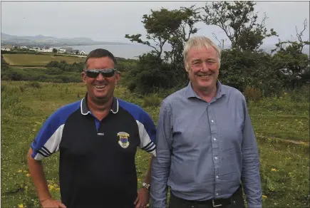  ??  ?? St Patrick’s GAA Club chairman John Gill and Donal Marron at the club’s new 30-acre site on the Greenhill Road.