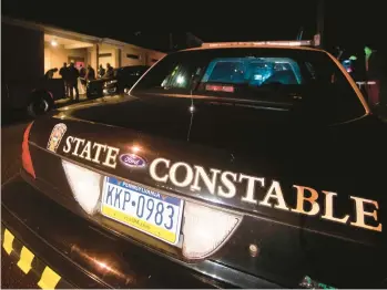  ?? RICK KINTZEL/THE MORNING CALL ?? A state constable vehicle is parked outside the Fearless Fire Company during an election night in Allentown.