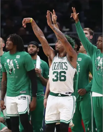  ?? NANCY LANE PHOTOS / HERALD STAFF FILE ?? UNABLE TO GO: Marcus Smart’s foot sprain kept him out of Tuesday night’s series opener with the Miami Heat.