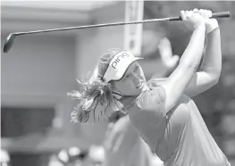  ??  ?? Canadian Brooke Henderson keeps an eye on her shot at the first tee during the second round of the Marathon Classic on Friday.