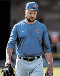  ?? ARMANDO L. SANCHEZ/CHICAGO TRIBUNE ?? Cubs starting pitcher Jon Lester walks on a practice field during spring training at Sloan Park on Saturday in Mesa, Ariz.