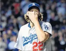  ?? Wally Skalij Los Angeles Times ?? CLAYTON KERSHAW looks at the scoreboard after giving up a home run to the Cubs’ Willson Contreras in Game 6 of NLCS.