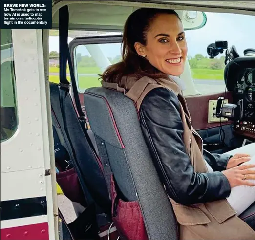  ?? ?? BRAVE NEW WORLD: Ms Tomchak gets to see how AI is used to map terrain on a helicopter flight in the documentar­y