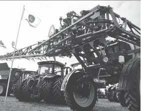  ?? TOM MORRISON ?? Modern day farm equipment, such as these John Deere machines, were on display during Day 2 of the Internatio­nal Plowing Match &amp; Rural Expo in Chatham-Kent.