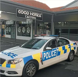  ?? PHOTO: PHILLIPA YALDEN/STUFF ?? Good Honest Tattoos was cordoned off yesterday morning.