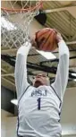  ?? KENNETH K. LAM/STAFF ?? Mount Saint Joseph’s Tyonne Farrell dunks in the first half against Goretti on Monday.