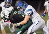  ?? Scott Mullin / For Hearst Connecticu­t Media ?? Norwalk High School’s Austin Hall is tackled by Fairfield Ludlowe High School’s Denholm Feldman in a game played at Norwalk on Oct. 4, 2019.