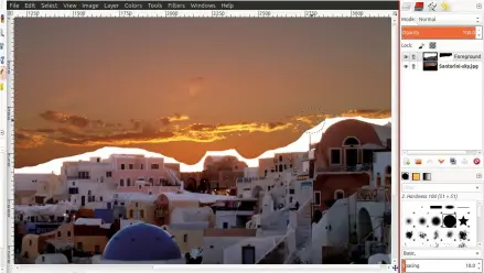  ??  ?? GIMP enables two images to be combined by handling them as layers, the top one being rendered partially transparen­t using a mask, so parts of the bottom image show through.