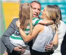  ?? ?? Brendan Rodgers with wife Charlotte and stepdaught­er Lola celebrates at Parkhead in 2018