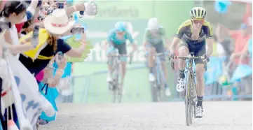  ?? AFP photo ?? Mitchelton–Scott’s British cyclist Simon Yates races towards the finish-line to win the 14th stage of the 73rd edition of ‘La Vuelta’ Tour of Spain cycling race, a 171-km route from Cistierna to Les Praeres next to Nava. —