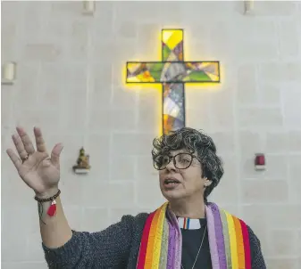 ?? RAMON ESPINOSA, THE ASSOCIATED PRESS ?? Rev. Elaine Saralegui, wearing a rainbow-coloured clergy stole and her clerical collar, leads a service at the Metropolit­an Community Church, an LGBTQ+ inclusive house of worship in Matanzas, Cuba.
