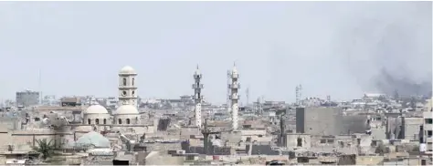  ?? — AFP ?? Smoke billows from Mosul’s Old City on Sunday during the ongoing offensive by Iraqi forces to retake the last district still held by the IS group.