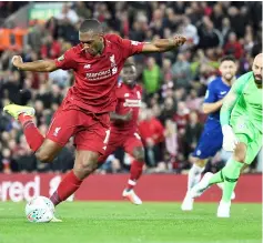  ??  ?? Sturridge (left) shoots towards an open goal but fails to score during the English League Cup third round match between Liverpool and Chelsea at Anfield in Liverpool, north west England in this Sept 26 file photo. — AFP photo