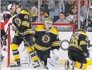  ?? ELISE AMENDOLA/AP PHOTO ?? Bruins goalie Jonas Gustavsson (50) reacts along with teammates Colin Miller (48) and John-Michael Liles (26) after the Senators scored in the second period of Saturday’s game. The Senators won 6-1.