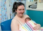  ?? DAVID UNWIN/STUFF ?? Kimberley Tait and baby Levi have their turn snuggled up on a feeding chair at Palmerston North Hospital’s neonatal unit.