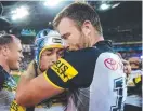  ??  ?? Johnathan Thurston and Cooper savour the Cowboys’ grand final win.