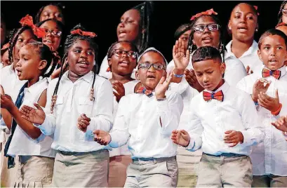  ?? [PHOTO BY NATE BILLINGS, THE OKLAHOMAN] ?? A choir of children and youths performs during the “Heaven Must Be Like This” musical concert Monday as part of the National Baptist Convention USA’s National Baptist Congress of Christian Education at the Cox Convention Center in Oklahoma City.