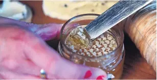  ??  ?? Comb honey in a jar.