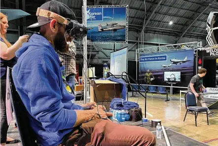  ?? THOMAS GNAU/STAFF ?? A micro-drone pilot at work: Kele Stanley demonstrat­ed how to fly a micro-drone at the National Museum of the U.S. Air Force Thursday.