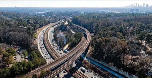  ?? HYOSUB SHIN / HYOSUB.SHIN@AJC.COM ?? A new segment of PATH400, nearly complete but still closed, runs along southbound Ga. 400. PATH400 through Buckhead is broken into two pieces, but a new piece set to open in early 2020 will link the two ends and complete the ride across one of the busiest parts of Atlanta.