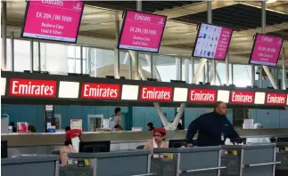  ??  ?? An Emirates ticketing counter at John F. Kennedy Internatio­nal Airport in New York. World airlines began applying new security standards and questionin­g passengers yesterday. (Reuters)