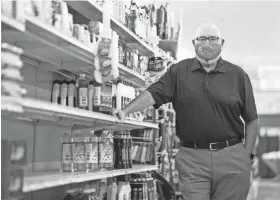  ?? MAX GERSH / THE COMMERCIAL APPEAL ?? Rick James, owner and CEO of Cash Saver, says some cleaning supplies are still hard to keep in stock. Photograph­ed Sept. 14 at Cash Saver in Memphis.