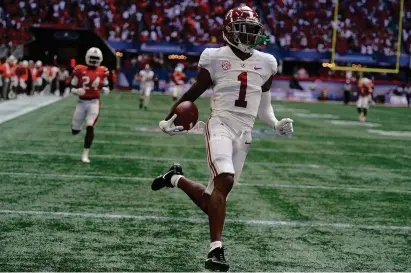  ?? (AP Photo/john Bazemore) ?? Alabama wide receiver Jameson Williams (1) scores after a catch during the second half of an NCAA college football game against Miami, Saturday, Sept. 4, 2021, in Atlanta.