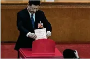  ?? ETIENNE OLIVEAU / GETTY IMAGES ?? Chinese President Xi Jinping votes during the third plenary session of the first session of the 13th National People’s Congress at The Great Hall of People on Sunday in Beijing. China’s parliament cleared the path for Xi to rule for life.