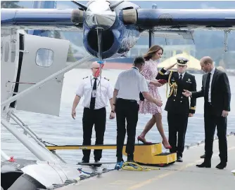  ??  ?? Catherine, Duchess of Cambridge, steps down from a Harbour Air Twin Otter seaplane onto the dock where Prince William was standing as they arrived in Vancouver on Sunday. It was an image that appeared around the world, giving global exposure to B.C....