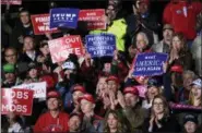  ?? SUSAN WALSH - THE ASSOCIATED PRESS ?? People listen as President Donald Trump speaks at a rally at Central Wisconsin Airport in Mosinee, Wis., Wednesday, Oct. 24.