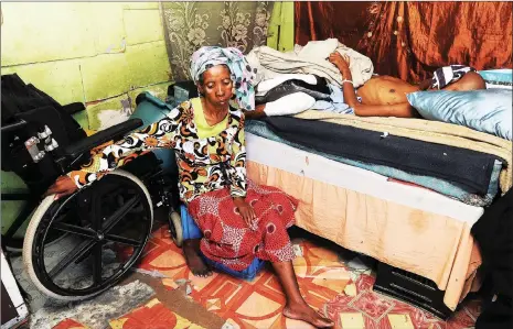  ?? Pictures: Cindy Waxa/African News Agency/ANA ?? HELPLESS: Lizeka Ncede sits alongside her disabled son, Bongile Ncede, 23, who was shot last year outside his house.